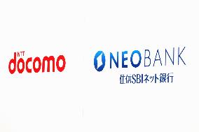 Signs and logos of NTT DoCoMo and SBI Sumishin Net Bank.